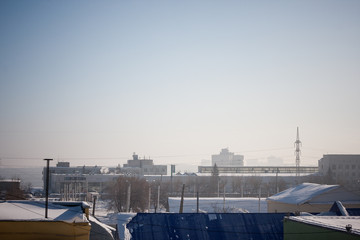 view of the winter city, shrouded in haze