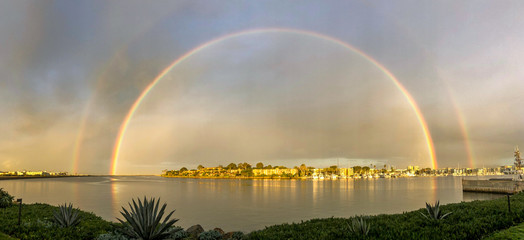 Morning rain shower rainbow over Marina del Rey between storms