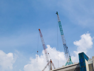 Construction crane on sky background.