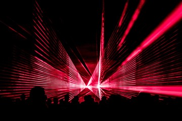 Red laser show nightlife club stage with party people crowd. Luxury entertainment with audience...