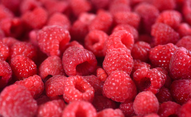 Fresh raspberries background closeup.