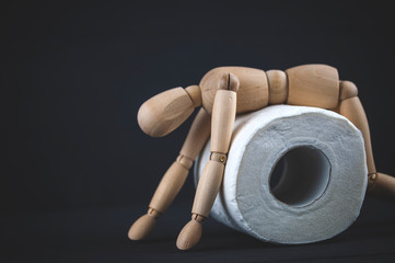 wooden mannequin on toilet paper, hype on toilet paper