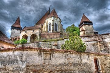 Biertan Fortified Church, located in Transylvania, Romania, dramatic view before a summer storm.