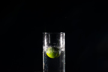 Throwing the lemon into a jar of water