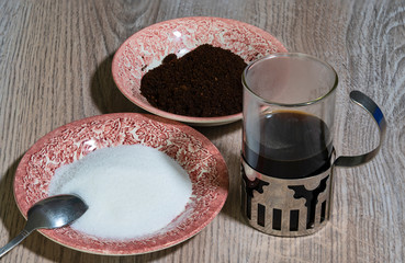 Glass of coffee with white sugar