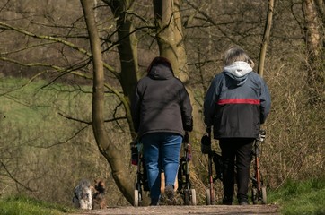 two old women with walker rolltors, mobility, walking aids, pensioners