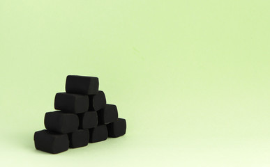 chewy liquorice candies on a green background