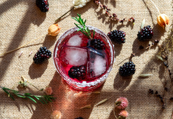 Cranberry & Vodka cocktail with blackberries and rosemary