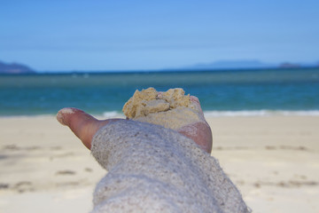 sand in hand