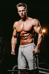 Fototapeta na wymiar muscular attractive man in gym