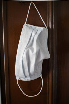 Face Mask Hanging On A Door