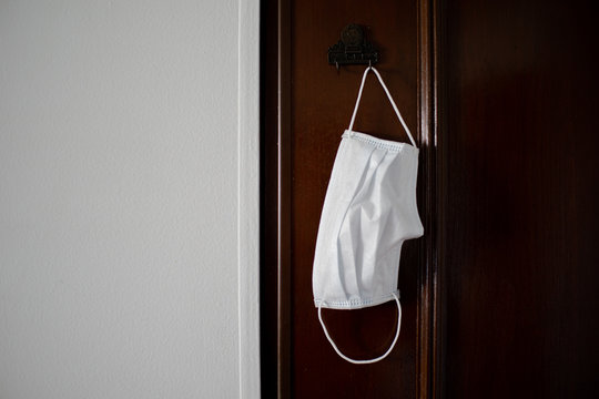 Face Mask Hanging On A Door