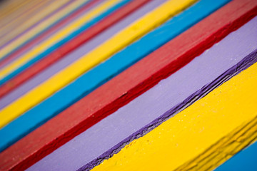 Multicolored painted wooden planks (selective focus)