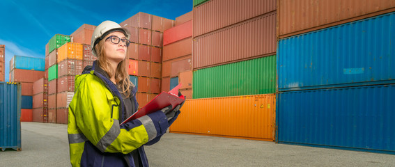 port employee checks containers in the container terminal