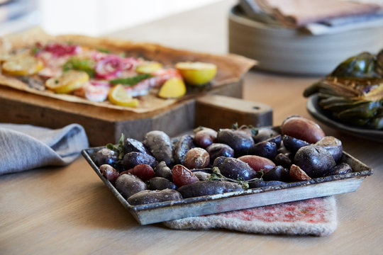 Baked salmon, potatoes and artichoke prepared for dinner