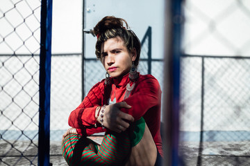 Charming Colombian woman holding head