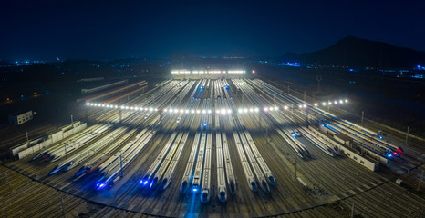 High angle view of train at rail yard shunting at night