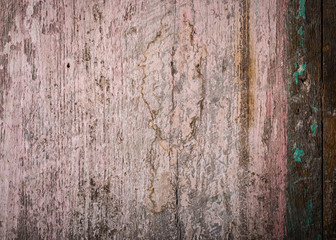 Pinks and turquoise flecks of paint and scratches with grain make a beautiful vintage background