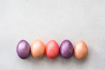 Easter eggs painted in pastel colours. Copy space. Top view.