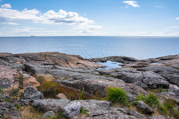 Fototapeta na wymiar View of the rocky shore and Gulf of Finland on the background, Isosaari island, Helsinki, Finland