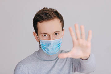 Protective mask. Open palm stop gesture. Stop epidemic. Virus concept. Epidemic infection. Critical...