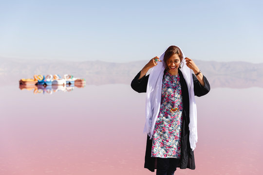 Young woman settles the veil