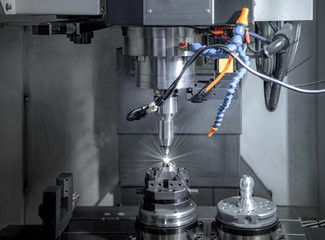 High precision CNC milling machine, operator machining metal part process in factory