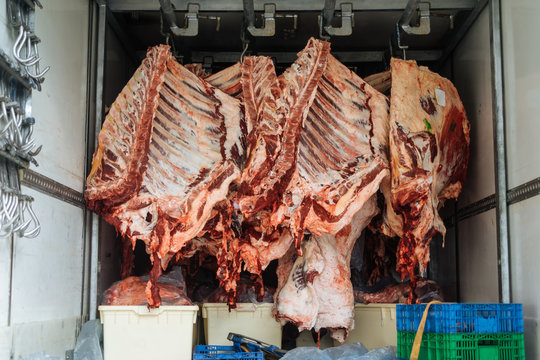 Refrigerated meat on hooks