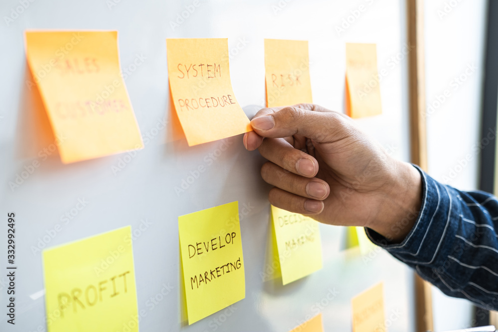 Poster young creative business people use post it notes sticky note on board to share idea, analysis data c