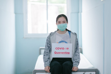 Fototapeta na wymiar coronavirus covid 19 infected patient in coronavirus covid 19 quarantine room with quarantine sign at hospital 