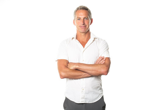 Portrait of confident mature man standing on white background