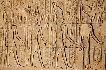 Fototapeta na wymiar Wall with ancient hieroglyphs of Karnak Temple drawings, Luxor, Egypt