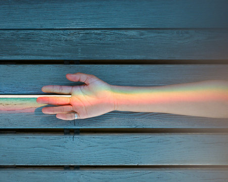 Rainbow in female hands