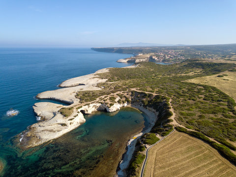 Arial view of a natural arch along the beach in Sardinia.
