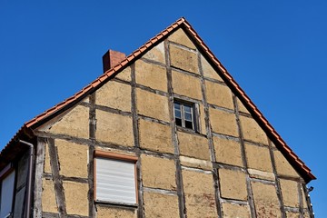 Historic Half-Timbered Gable: Traditional German Fachwerk Architecture with Weathered Clay Infill