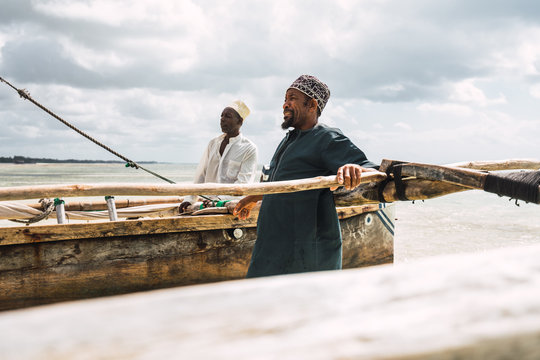 the arrival of two fishermen after a fishing day in Zanzibar, Tanzania