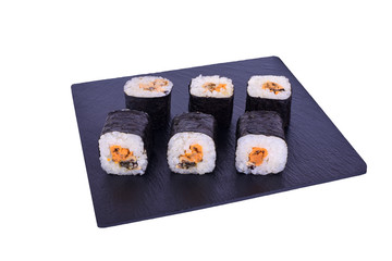 Traditional fresh japanese sushi maki on black stone Maki with mussels on a white background. Roll ingredients: mussels, nori, rice.