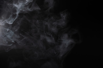 White steam on a black background.