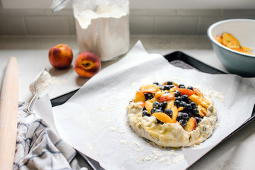 Uncooked blueberry and peach galette