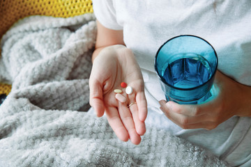 Anonymous female taking pills