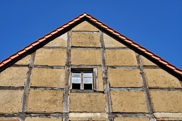Historic Half-Timbered Gable: Traditional German Fachwerk Architecture with Weathered Clay Infill