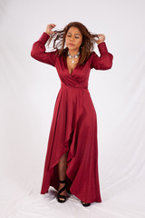 Thoughtful Hispanic woman with her hand in her hair