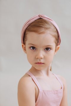 Closeup portrait of little serious girl