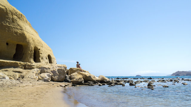 Mother with her son enjoying a beach day on their vacations