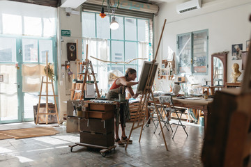 Artist woman drawing in her studio.