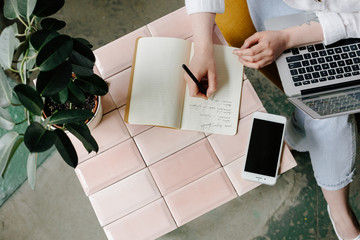 Woman take notes in notebook