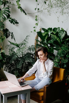 Woman Working On Laptop In Loft Studio