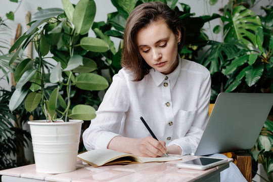 Woman take notes in notebook