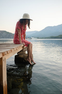 Woman relaxing on the boat pier