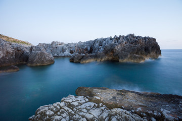 beautiful rocky beach at sunset of the Protected Marine Area Costa degli Infreschi and Masseta in...